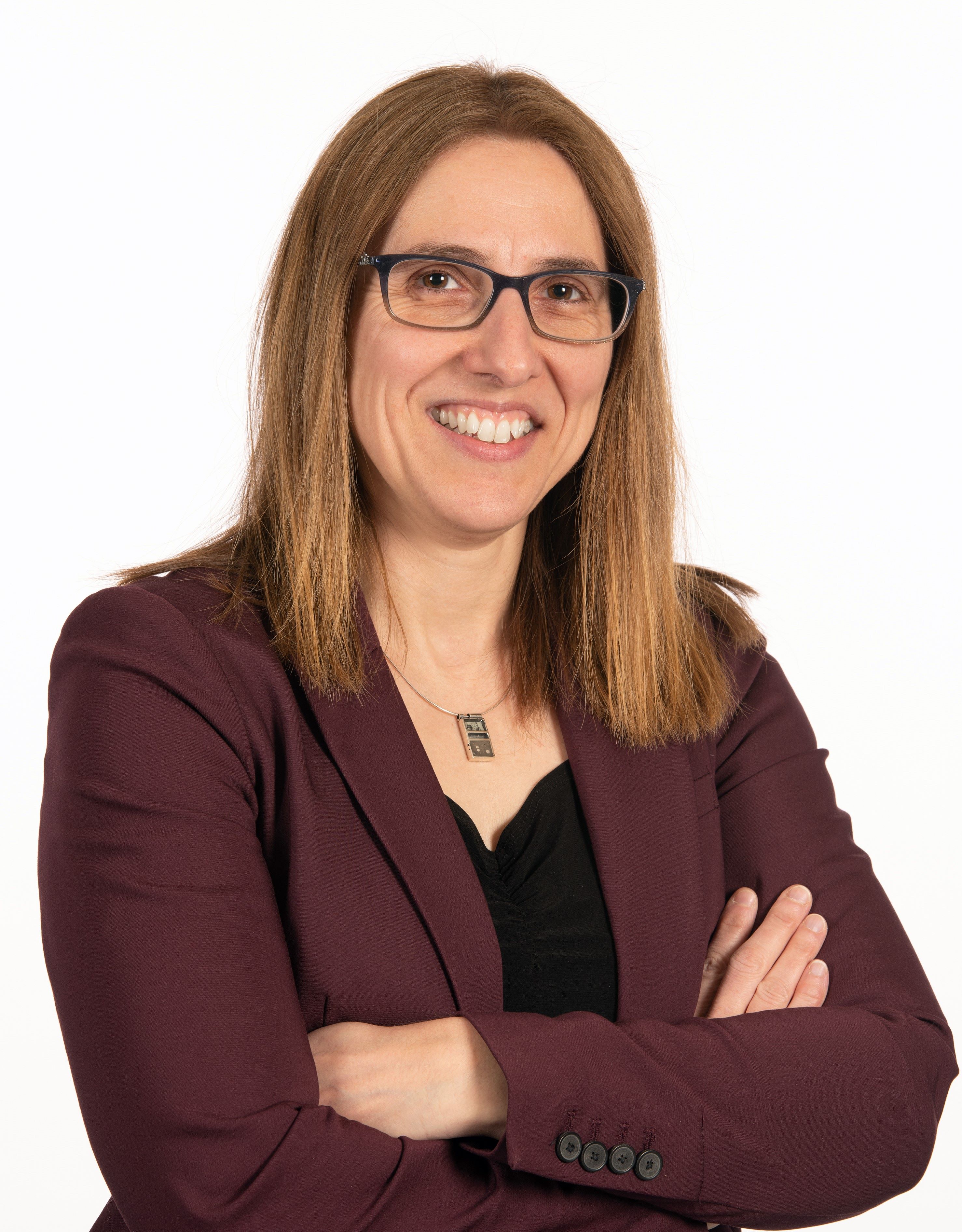 La directrice générale du Cégep Limoilou, Chantal Arbour, souriante et bras croisés.